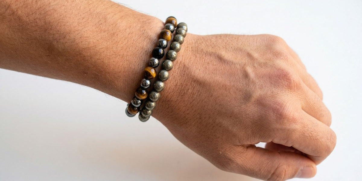 Gunmetal pyrite and triple protection round bead bracelets stacked on male wrist - Divine Sansar