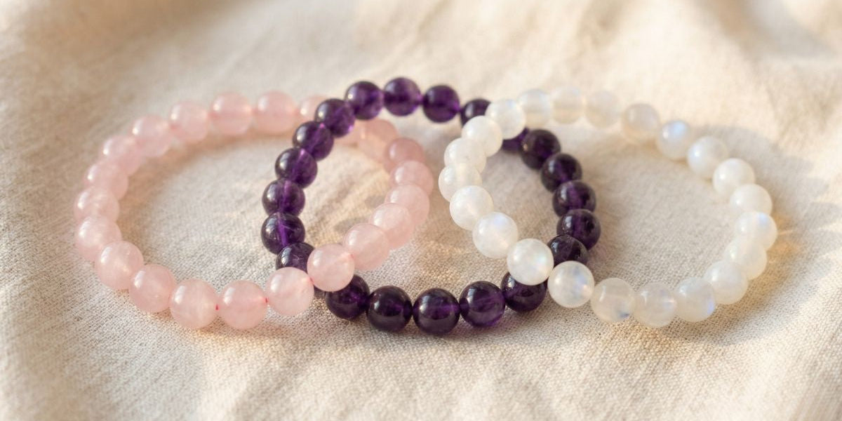 Rose quartz amethyst and moonstone round bead bracelets on cream fabric - Divine Sansar UAE