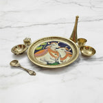 Cow and calf brass pooja thali set 16cm with diya, ghanti and agarbatti stand on white marble - Divine Sansar