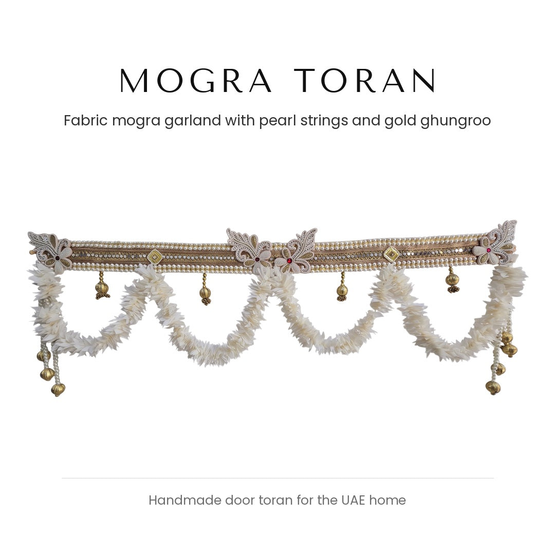 White fabric mogra toran with pearl band and gold ghungroo by Divine Sansar