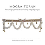 White fabric mogra toran with pearl band and gold ghungroo by Divine Sansar