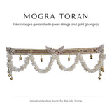 White fabric mogra toran with pearl band and gold ghungroo by Divine Sansar