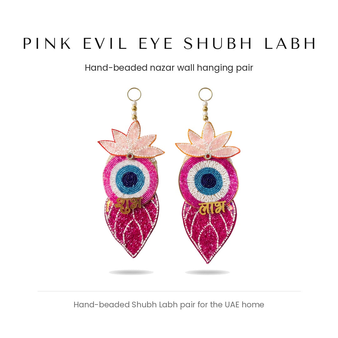 Pink evil eye Shubh Labh hand-beaded wall hanging pair by Divine Sansar