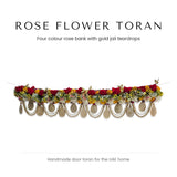 Rose flower door toran with gold jali teardrops and pearl swags by Divine Sansar