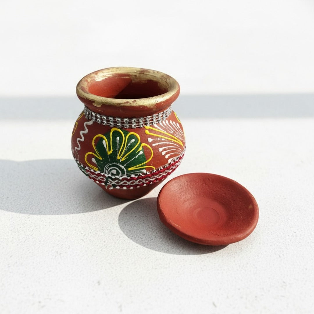 Clay karwa pot with lid off showing gold rim and rhinestone band - Divine Sansar