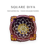 Hand-painted square clay diya with maroon and purple mandala, top view - Divine Sansar