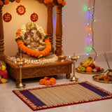 Red border kusha pooja aasan in front of Ganesh mandir - Divine Sansar