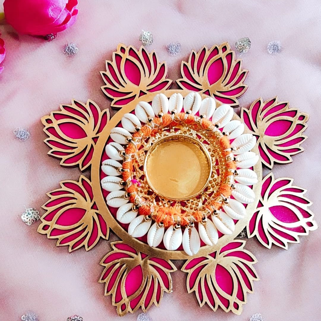 Pink lotus cut-work diya platter with cowrie ring styled for Diwali - Divine Sansar
