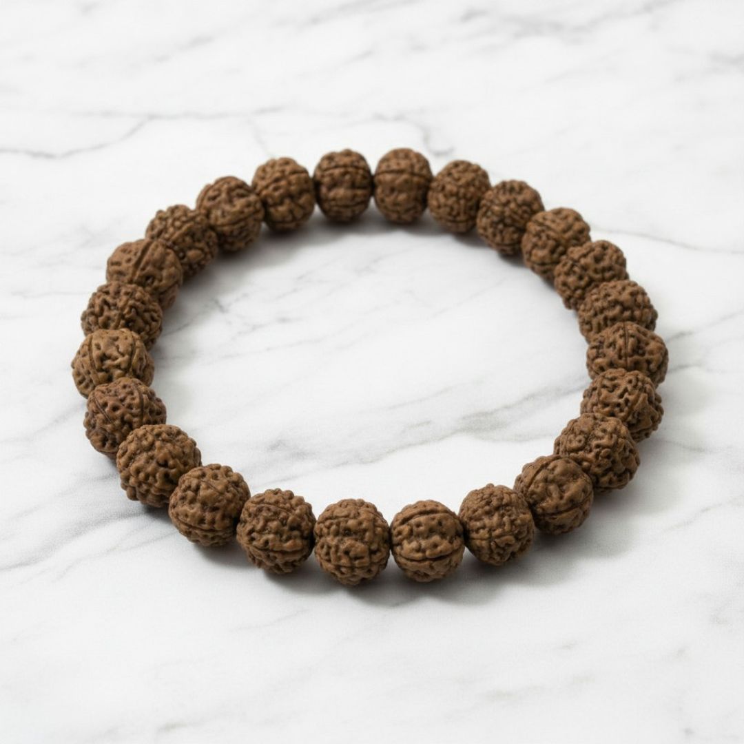 Authentic Rudraksha bracelet on white marble, natural rudraksh beads - Divine Sansar