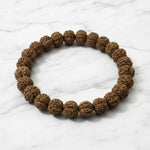 Authentic Rudraksha bracelet on white marble, natural rudraksh beads - Divine Sansar