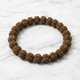 Authentic Rudraksha bracelet on white marble, natural rudraksh beads - Divine Sansar