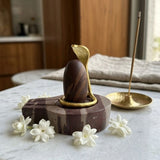 Narmadeshwar Shivling stone peetham with jasmine flowers for home pooja - Divine Sansar