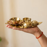 Brass lotus diya kumkum pooja set held in hand to show size - Divine Sansar