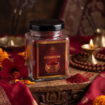 Haldi kumkum powder for tilak beside a lit brass diya and rudraksha mala - Divine Sansar