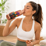 Woman drinking from 7 Chakra copper water bottle - Divine Sansar