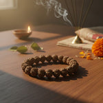Rudraksha bracelet with diya and marigold for daily puja and meditation - Divine Sansar
