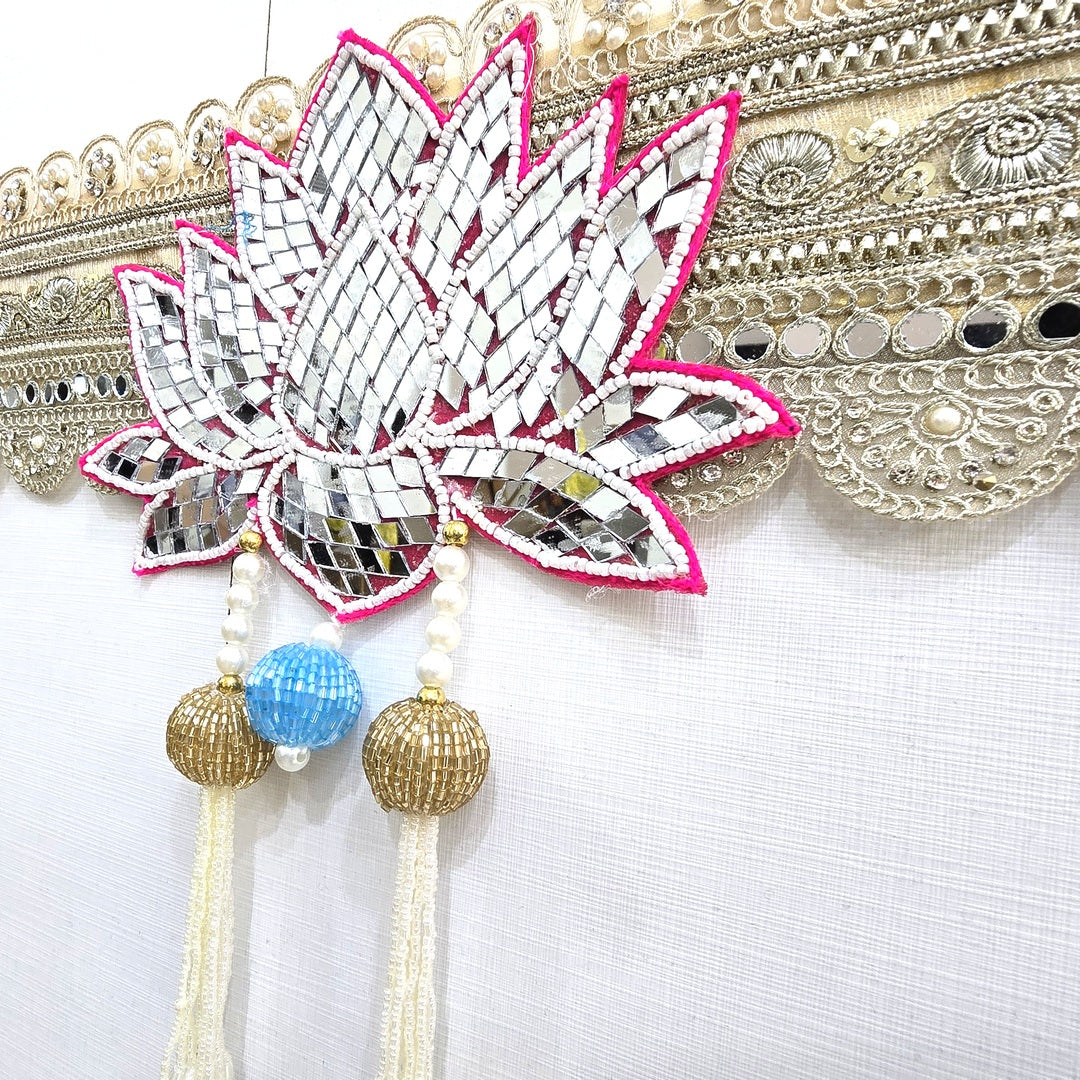 Cut mirror lotus centrepiece on the Divine Sansar bandhanwar with beaded tassels