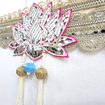 Cut mirror lotus centrepiece on the Divine Sansar bandhanwar with beaded tassels