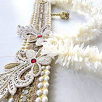 Pearl and zari band detail on the Divine Sansar mogra toran with silver lace motif