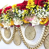 Gold jali teardrop and pearl bead swag detail on the Divine Sansar rose toran