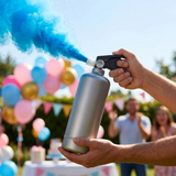 Blue gender reveal color blaster firing a powder cloud - Divine Sansar UAE