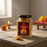 Chandan kesar powder jar with a spoon of tilak powder for daily pooja - Divine Sansar