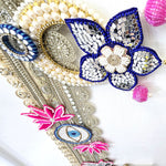 Corner beadwork with pearl ring and pink beaded bells on the Divine Sansar bandhanwar