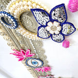 Corner beadwork with pearl ring and pink beaded bells on the Divine Sansar bandhanwar