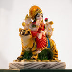 Three-quarter view of polyresin Sherawali Durga murti with golden halo and lotus - Divine Sansar