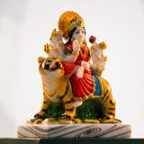 Three-quarter view of polyresin Sherawali Durga murti with golden halo and lotus - Divine Sansar