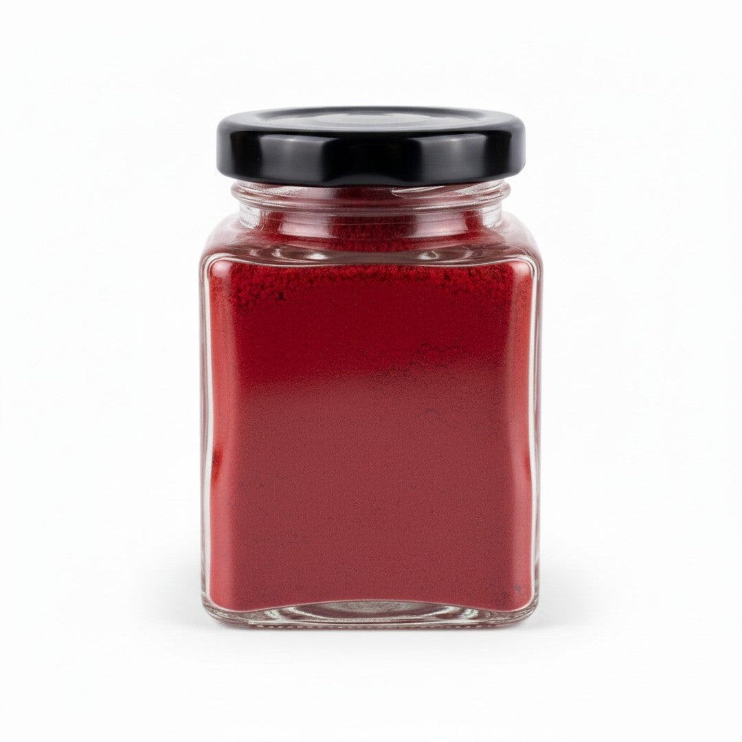 Deep red natural kumkum powder filling a 100g glass jar - Divine Sansar