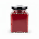 Deep red natural kumkum powder filling a 100g glass jar - Divine Sansar
