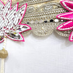 Gold lace band with blue evil eye and pink lotus beadwork on the Divine Sansar bandhanwar