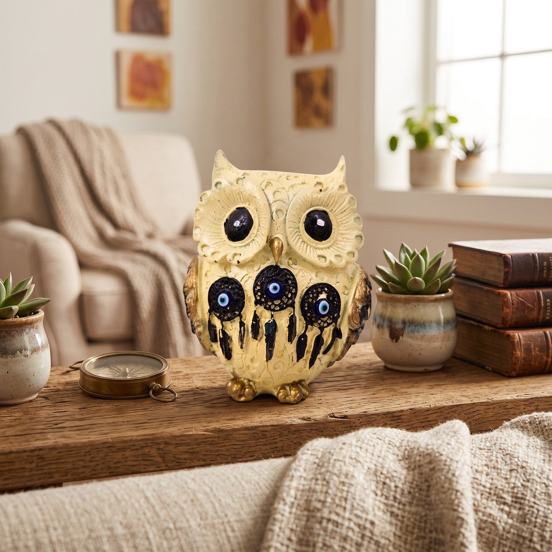 Off white Lakshmi owl figurine on a living room shelf - Divine Sansar