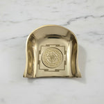Brass Shree Yantra soop murum on white marble, engraving close up - Divine Sansar