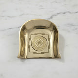 Brass Shree Yantra soop murum on white marble, engraving close up - Divine Sansar