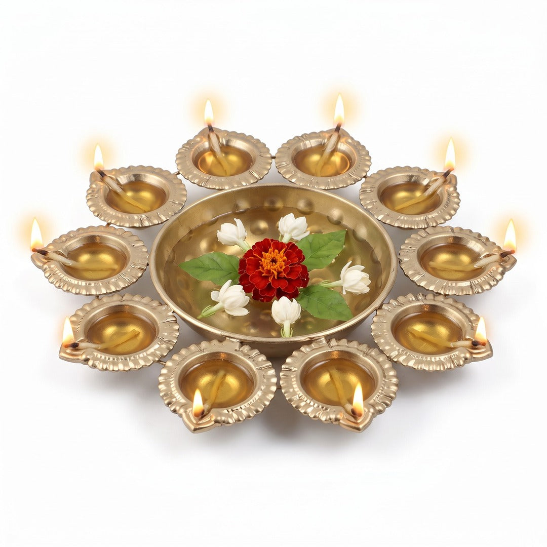 10 diya urli with all ten diyas lit and marigold floating in water, Divine Sansar