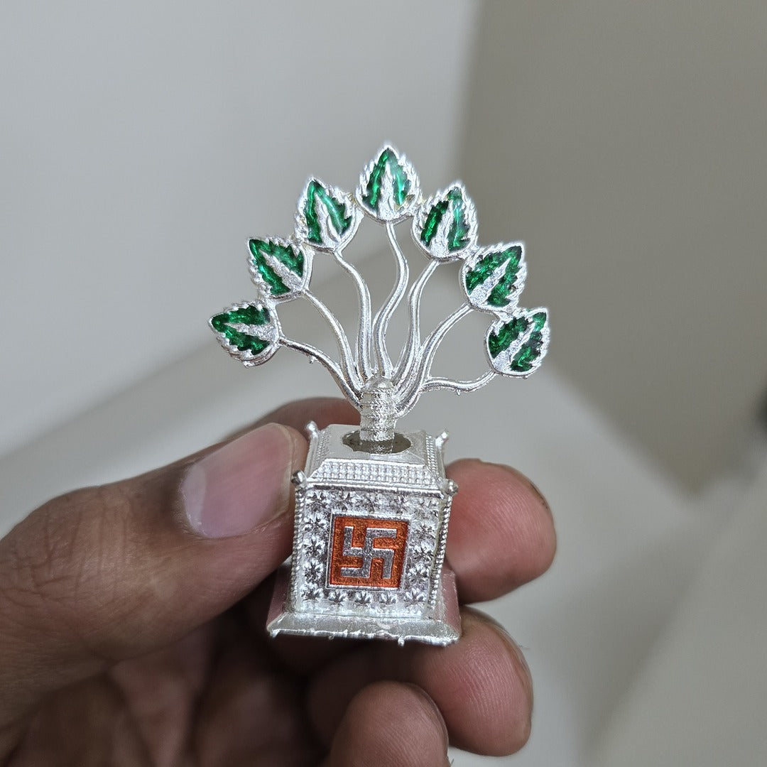 Silver metal Tulsi plant held in hand to show its true 5 cm size - Divine Sansar