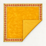 Yellow velvet pooja aasan folded to show the matching cotton back - Divine Sansar