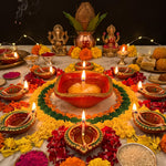 365 batti deepam glowing at the centre of a flower rangoli with clay diyas - Divine Sansar