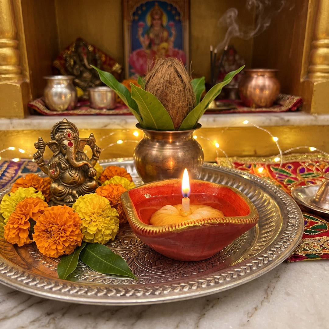 365 batti lit in a red and gold chaumukhi diya at a home mandir - Divine Sansar