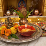 Chaumukhi diya lit with a 365 batti at a home mandir - Divine Sansar