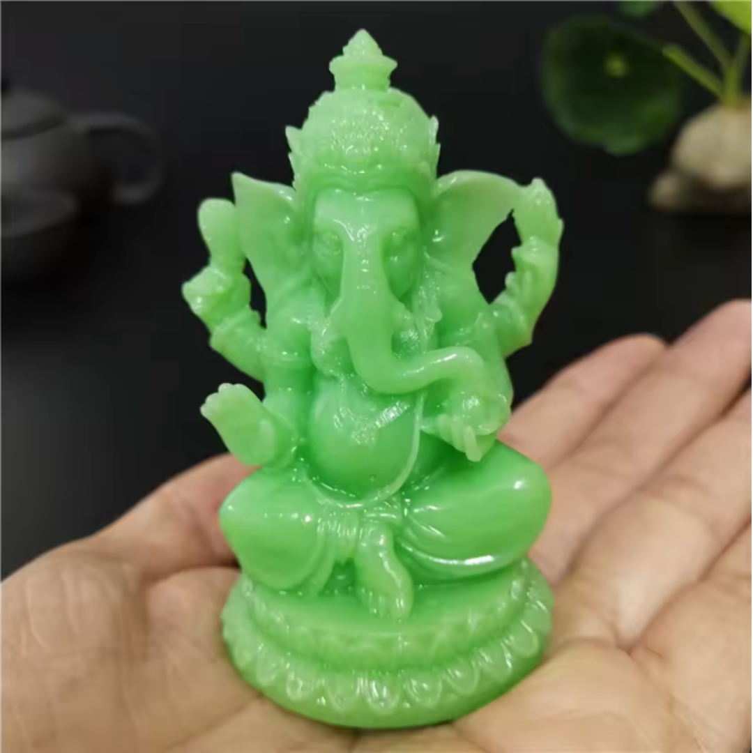 Divine Sansar jade Ganesha statue held in a hand