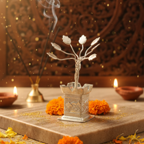 Divine Sansar Decorative Shri Tulsi Silver Small with flowers and candles on a textured surface