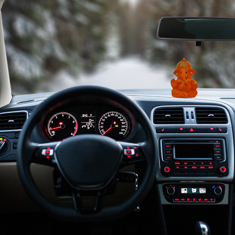 Divine Sansar-Auspicious Lord Ganesha Murti-Car interior with dashboard and steering wheel, featuring Ganesha statue on the dashboard.