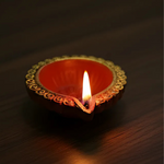 Divine Sansar-Clay Diya decorated on a dark background