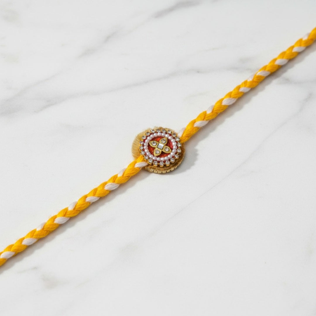 Pearl and kundan moti rakhi on marble - Divine Sansar UAE