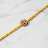 Pearl and kundan moti rakhi on marble - Divine Sansar UAE