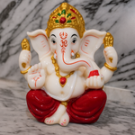Divine Sansar Divine Ganesha Statue-White and Maroon on a marble background