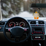 Divine Ganesha Statue White and Orange-Car interior with dashboard lights on, steering wheel, and a Ganesha statue on the dashboard.